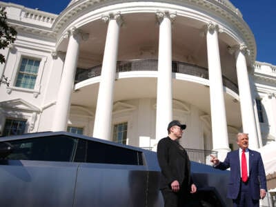 President Donald Trump and Elon Musk deliver remarks next to a Tesla Cybertruck on the South Lawn of the White House on March 11, 2025, in Washington, D.C.