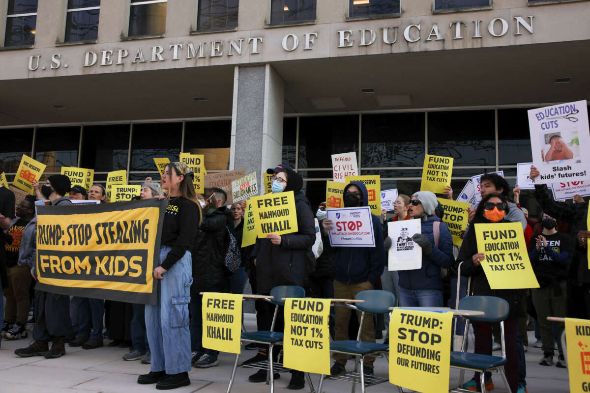 Demonstrators gather outside of the offices of the U.S. Department of Education in Washington, D.C., on March 13, 2025, to protest against mass layoffs and budget cuts at the agency, initiated by the Trump administration and DOGE.