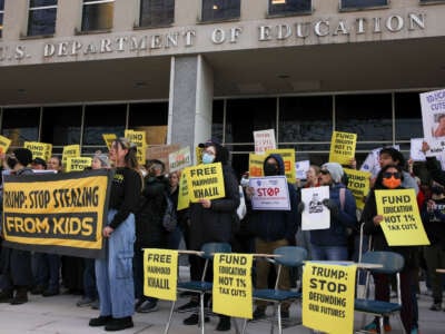 Demonstrators gather outside of the offices of the U.S. Department of Education in Washington, D.C., on March 13, 2025, to protest against mass layoffs and budget cuts at the agency, initiated by the Trump administration and DOGE.