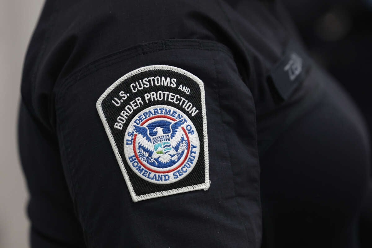 U.S. Customs and Border Protection agent is pictured in the FedEx Cargo hub at Miami International Airport on February 12, 2025, in Miami, Florida.