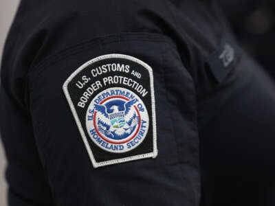 U.S. Customs and Border Protection agent is pictured in the FedEx Cargo hub at Miami International Airport on February 12, 2025, in Miami, Florida.