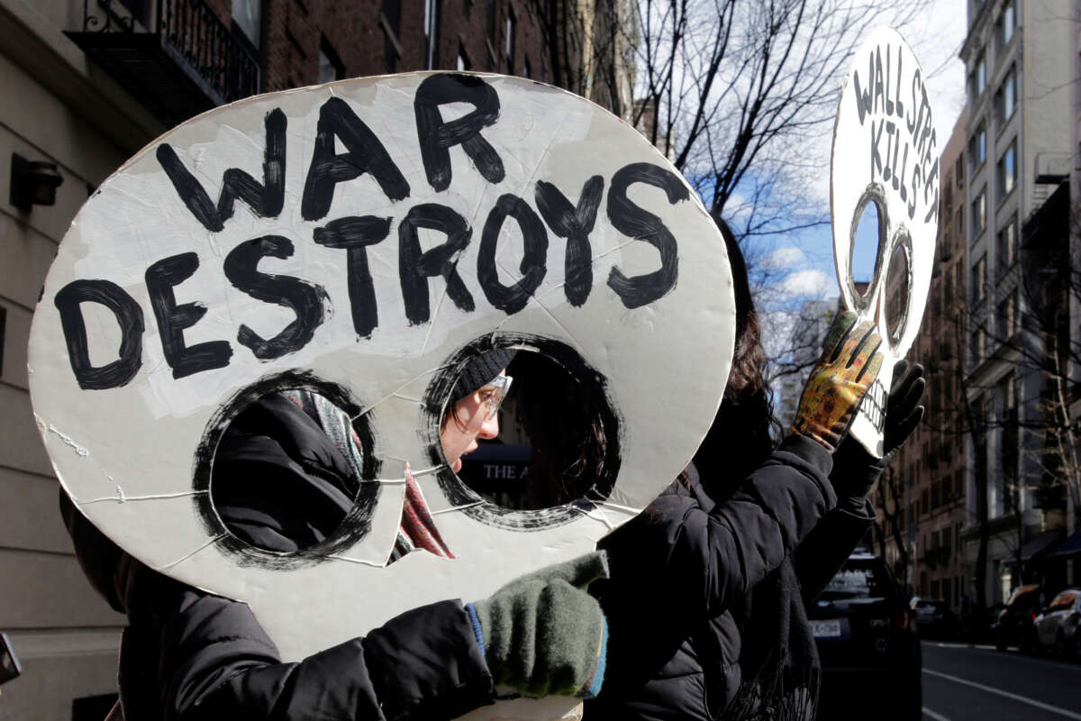 People hold an antiwar vigil on the 20th anniversary of the U.S. war in Iraq, on March 19, 2023, in New York City.