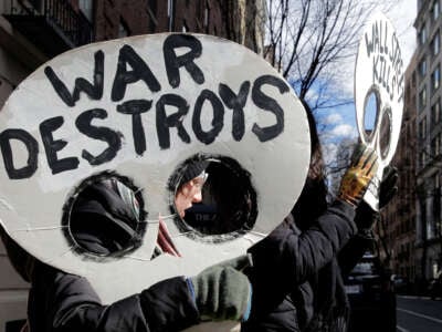 People hold an antiwar vigil on the 20th anniversary of the U.S. war in Iraq, on March 19, 2023, in New York City.