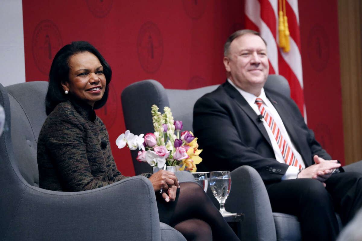 Condoleezza Rice sits next to Mike Pompeo