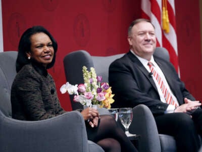 Condoleezza Rice sits next to Mike Pompeo