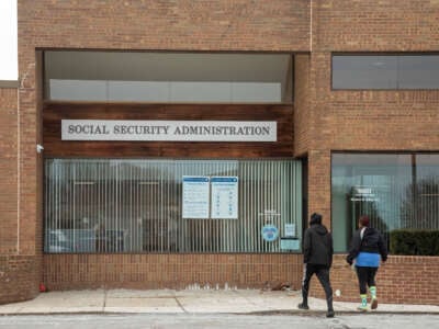 Two people enter a Social Security Administration office in suburban Detroit.