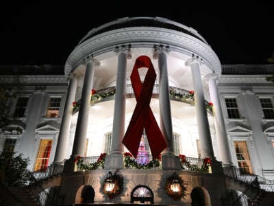 A red ribbon is displayed on the South Lawn of the White House to recognize World AIDS Day on December 1, 2024, in Washington, D.C.