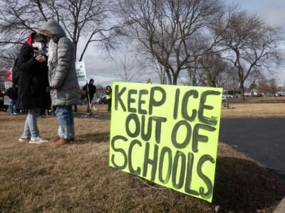 Demonstrators hold a rally and march to protest a recent increase of activity in the area by Immigration and Customs Enforcement (ICE) agents on February 1, 2025, in Waukegan, Illinois.