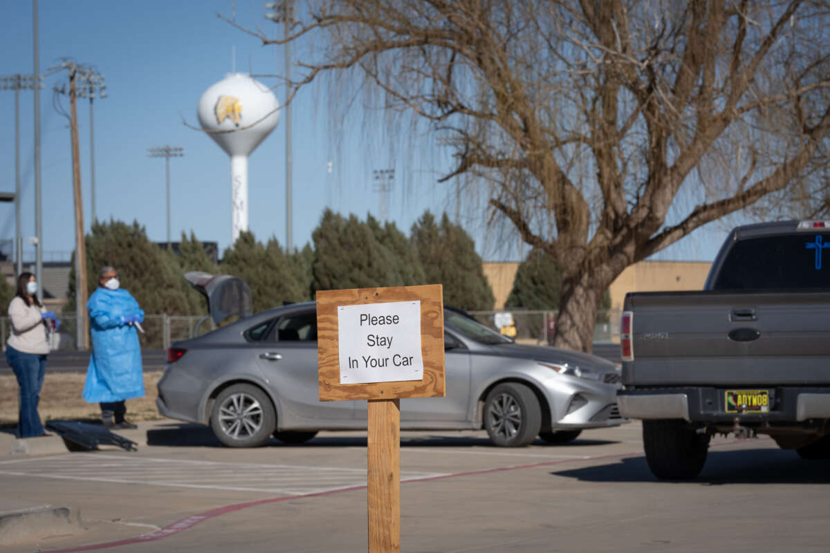 Signs point the way to measles testing in the parking lot of the Seminole Hospital District across from Wigwam Stadium on February 27, 2025, in Seminole, Texas.