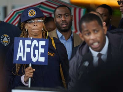 Roslyn Austin Stewart listens as the American Federation of Government Employees, the union that represents Transportation Safety Administration officers, holds a press conference in front of the Tom Bradley International Terminal at LAX in Los Angeles on January 16, 2019.