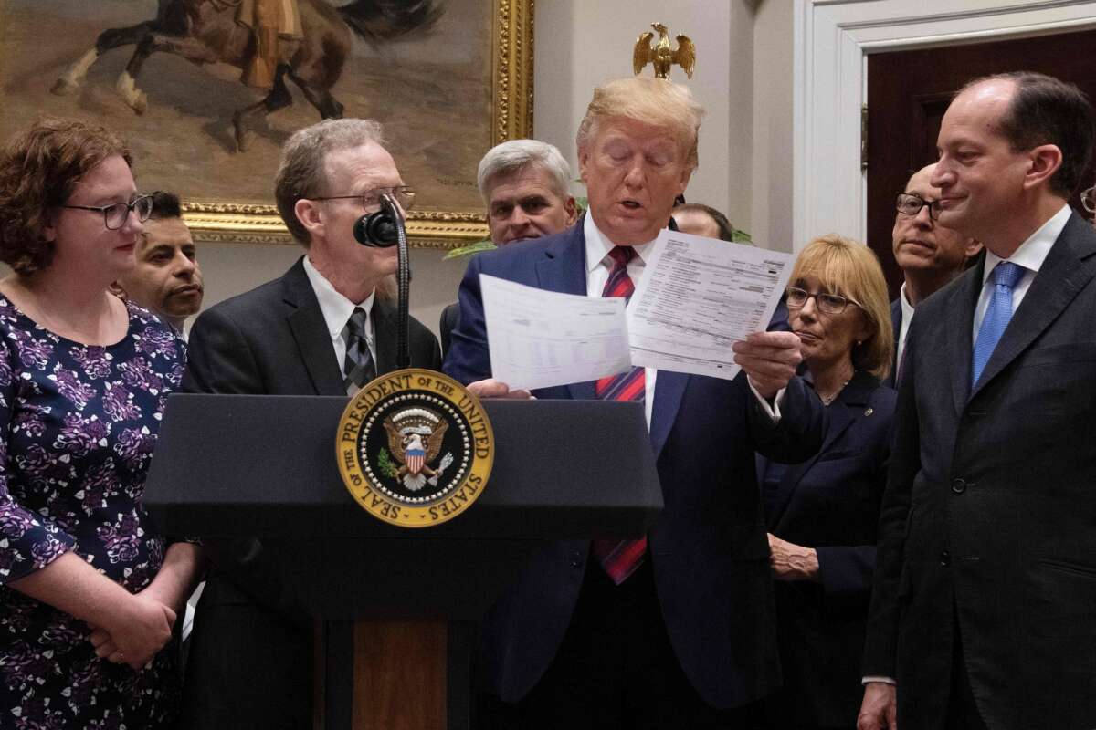 President Trump looks at a medical bill as he speaks during event on ending surprise medical billing at the White House in Washington, D.C., on May 9, 2019.