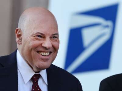 U.S. Postmaster General Louis DeJoy attends an event announcing the Postal Service's plan on implementing electric vehicles, at the Postal Service Headquarters on December 20, 2022, in Washington, D.C.