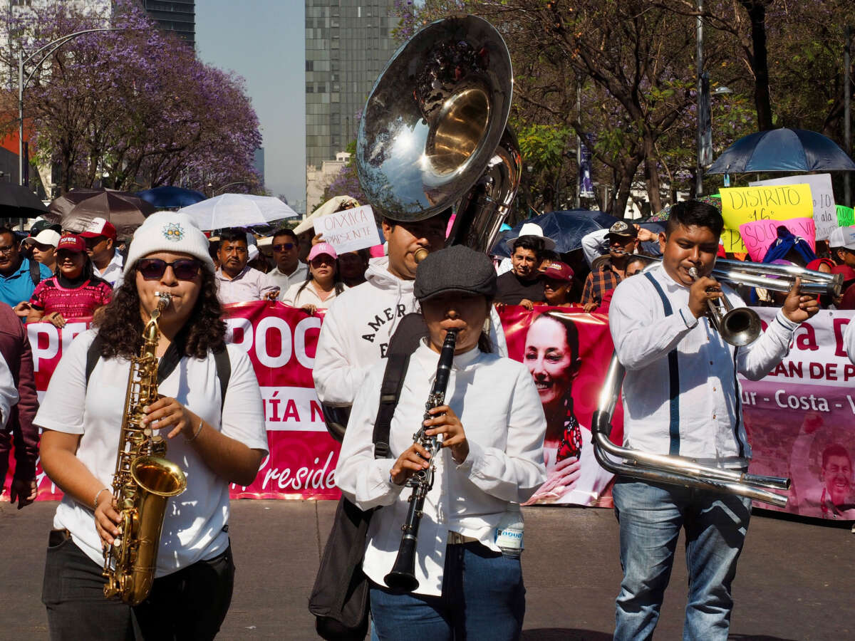 A band from Pochutla, Oaxaca accompanying a folkloric Indigenous dance troupe performs on Juarez Avenue in Mexico City on Sunday, March 9, 2025.