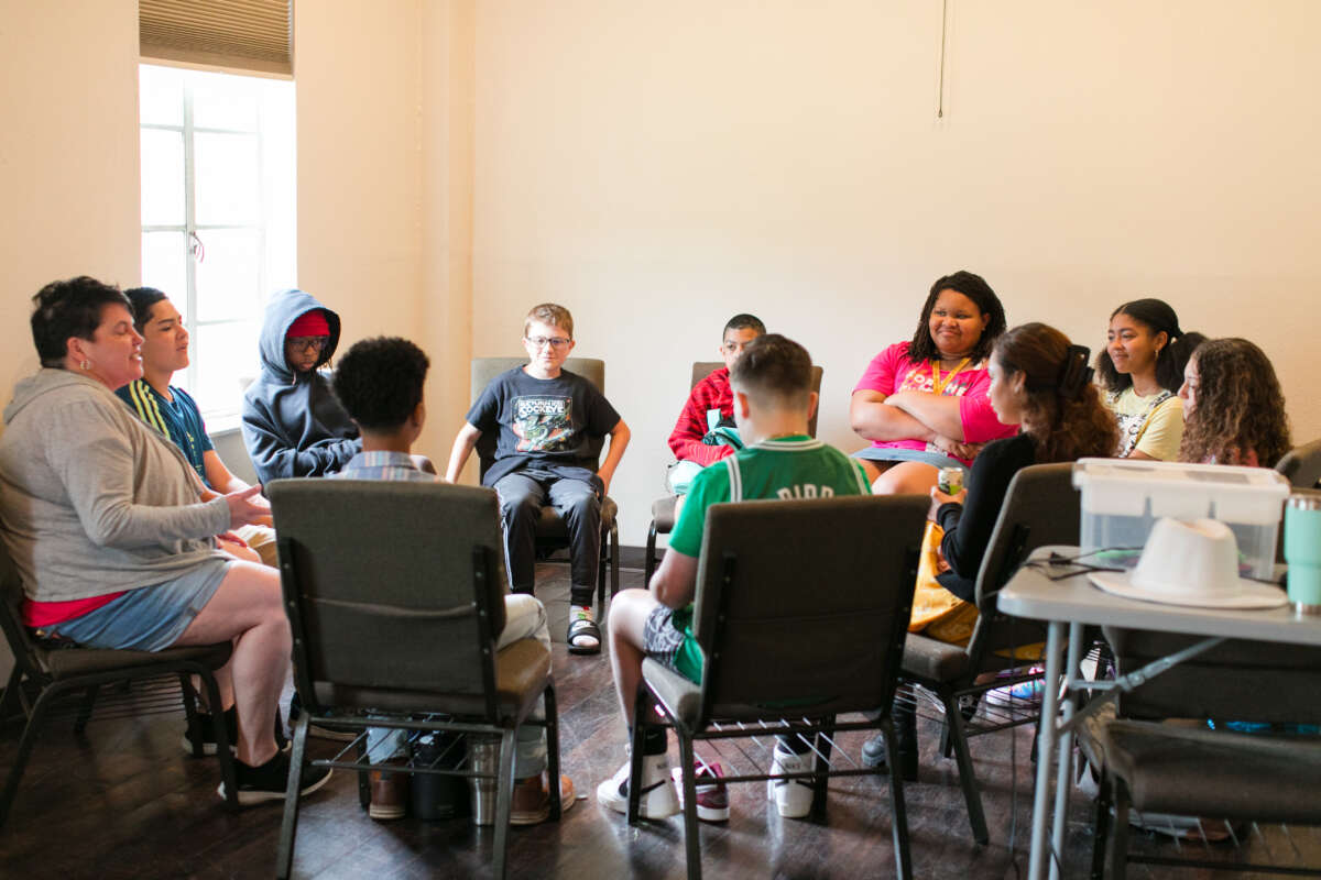 Students practice public speaking in a circle at For the Culture in San Antonio, Texas.