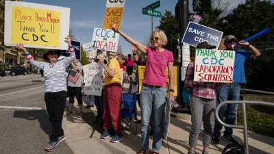 People demonstrate outside the main campus of the Centers For Disease Control and Prevention (CDC) on April 1, 2025 in Atlanta, Georgia.