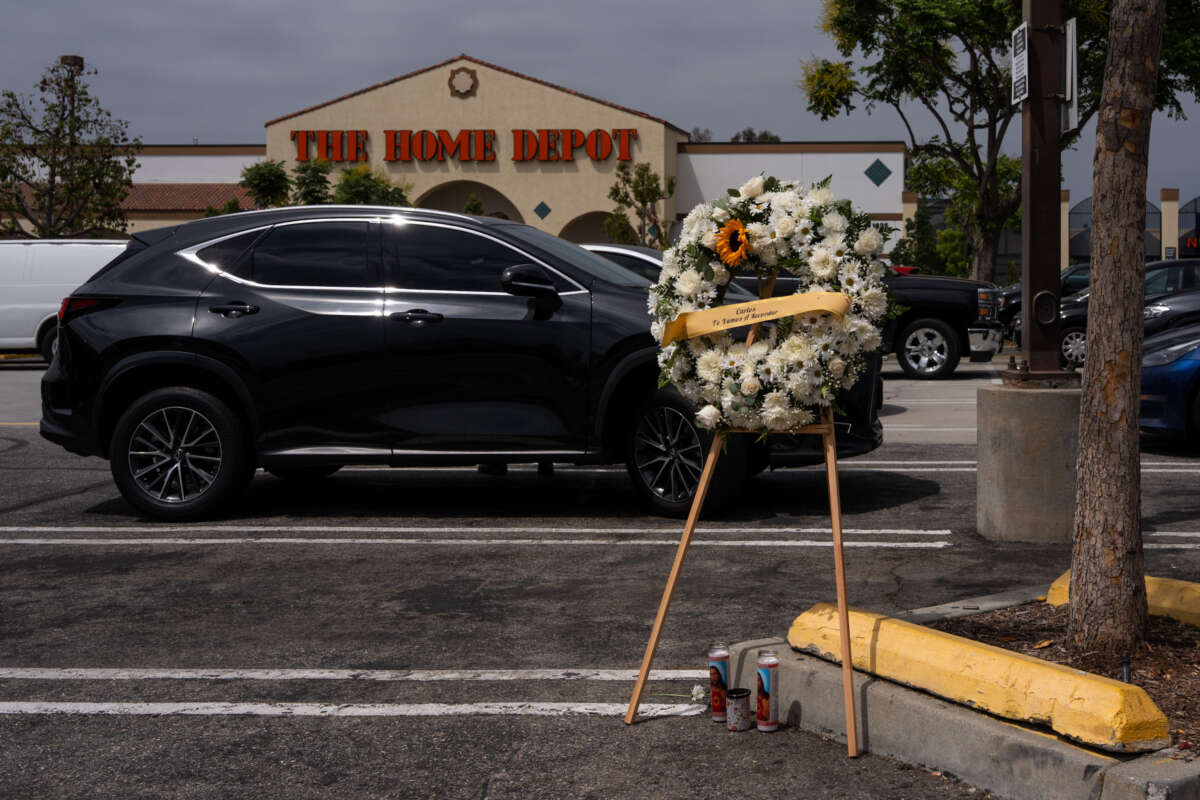A wreath for the late Carlos Roberto Montoya, a 52-year-old man from Guatemala, is placed in the parking lot of Home Depot on August 16, 2025 in Monrovia, California.