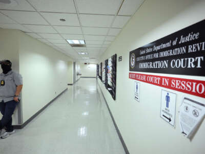 Federal agents patrol the halls of immigration court at the Jacob K. Javitz Federal Building on August 28, 2025 in New York City.