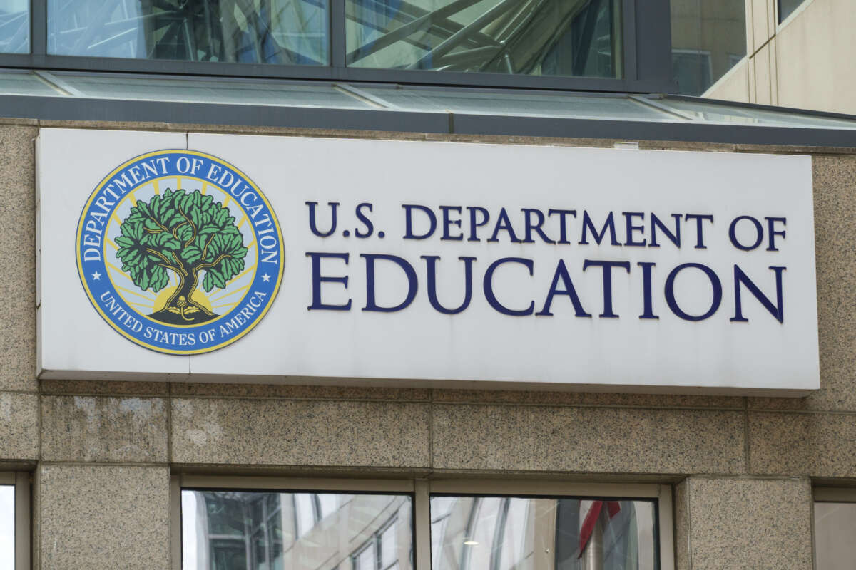 A Department of Education sign is displayed outside of their federal student aid office in Washington, D.C.