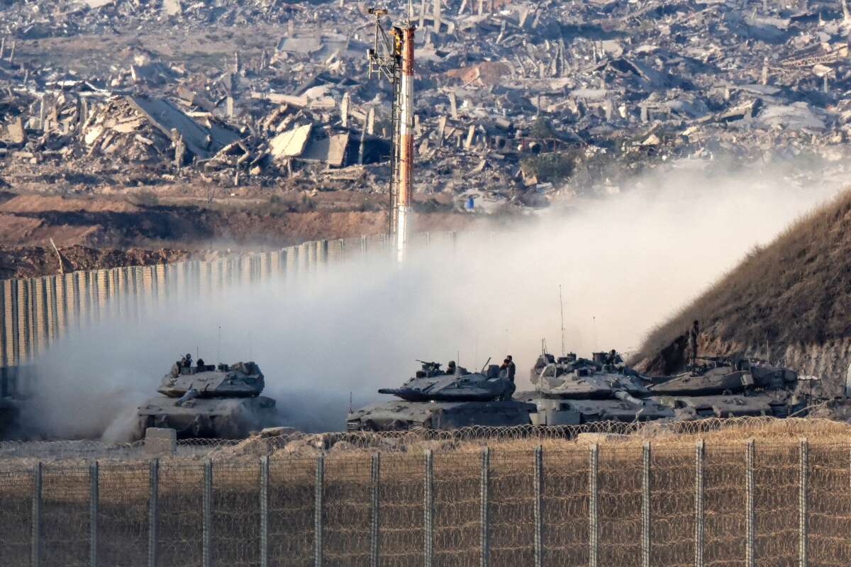 Israeli army main battle tanks move along the border with the Gaza Strip in southern Israel on August 27, 2025. The Israeli military pressed operations around Gaza City on August 27, as President Donald Trump prepared to host a White House meeting on post-war plans for the shattered Palestinian territory.