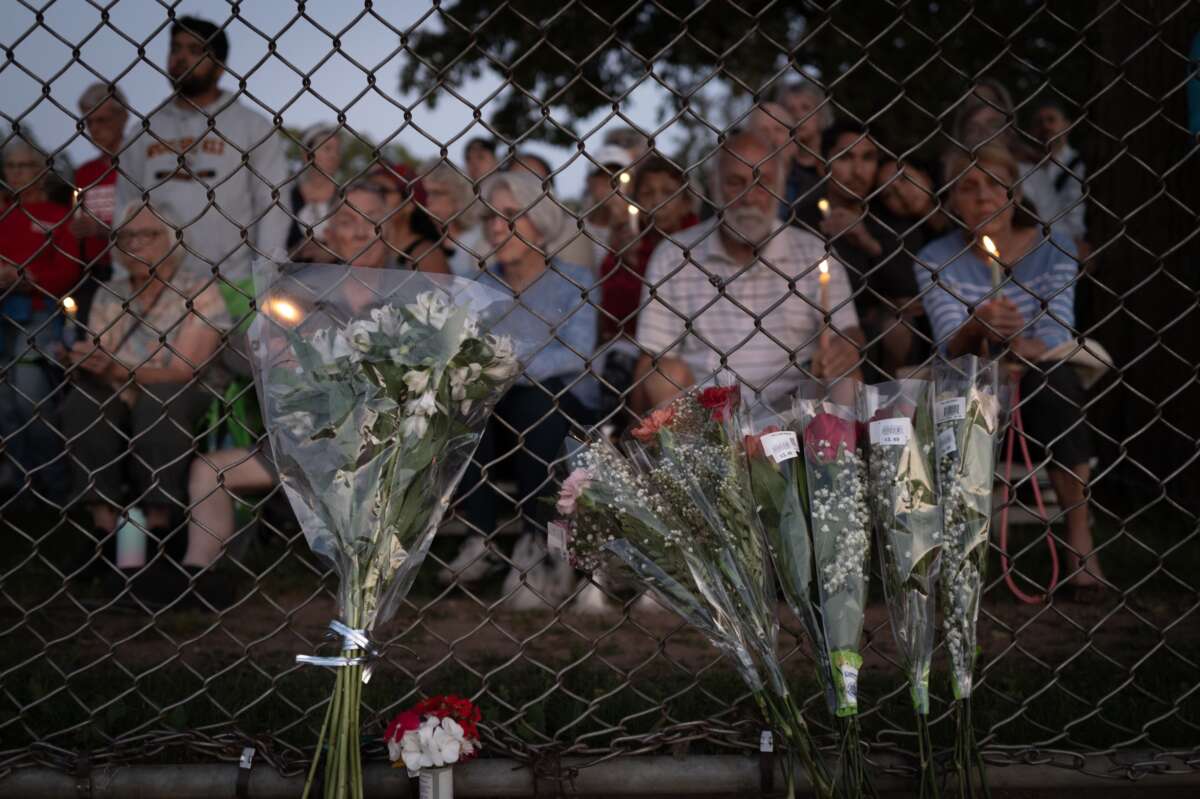 People attend a vigil at Lynnhurst Park to mourn the dead and pray for the wounded after a gunman opened fire on students at Annunciation Catholic School on August 27, 2025 in Minneapolis, Minnesota.