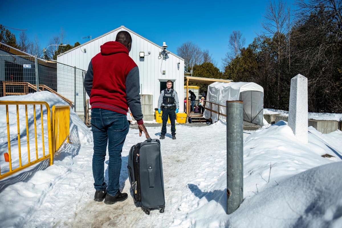 Marcello, who is Haitian and came via Mexico, then the United States, arrives at the Roxham Road border crossing in Roxham, Quebec, on March 3, 2023.