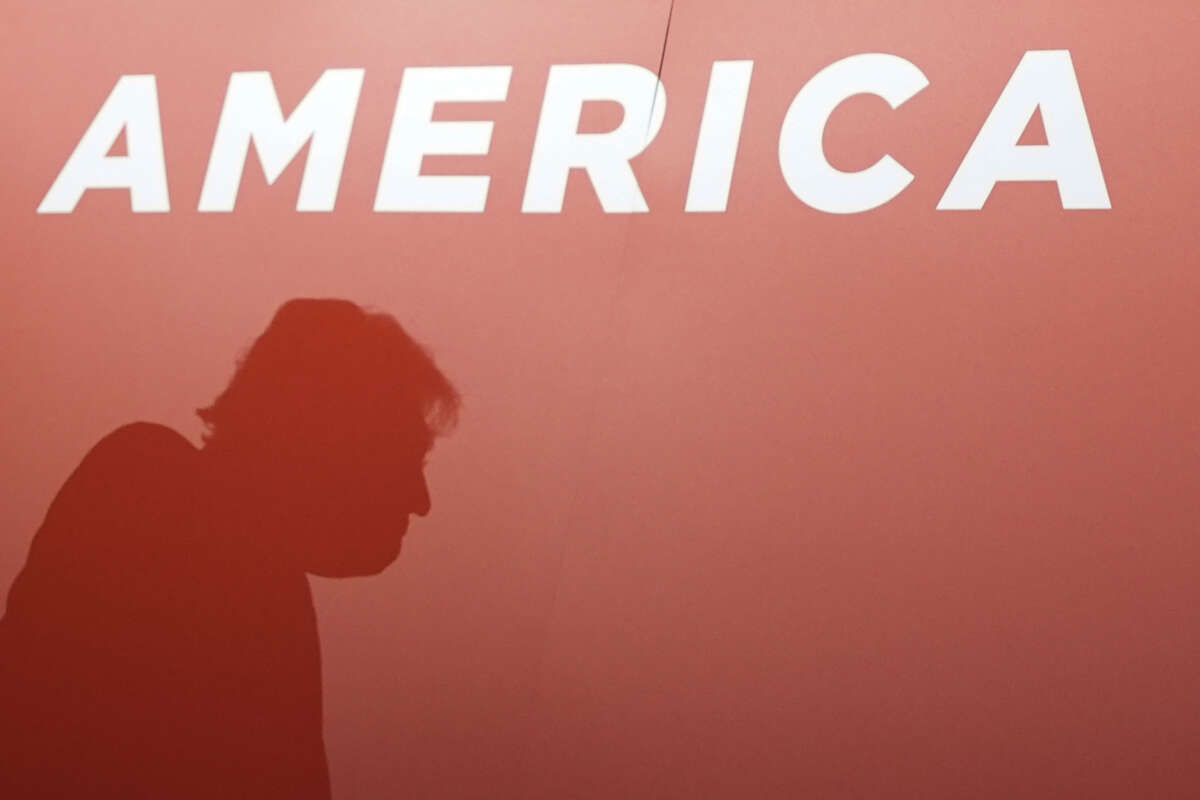 A silhouette of Donald Trump appears as he attends the first day of the Republican National Convention at the Fiserv Forum on July 15, 2024, in Milwaukee, Wisconsin.