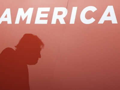 A silhouette of Donald Trump appears as he attends the first day of the Republican National Convention at the Fiserv Forum on July 15, 2024, in Milwaukee, Wisconsin.