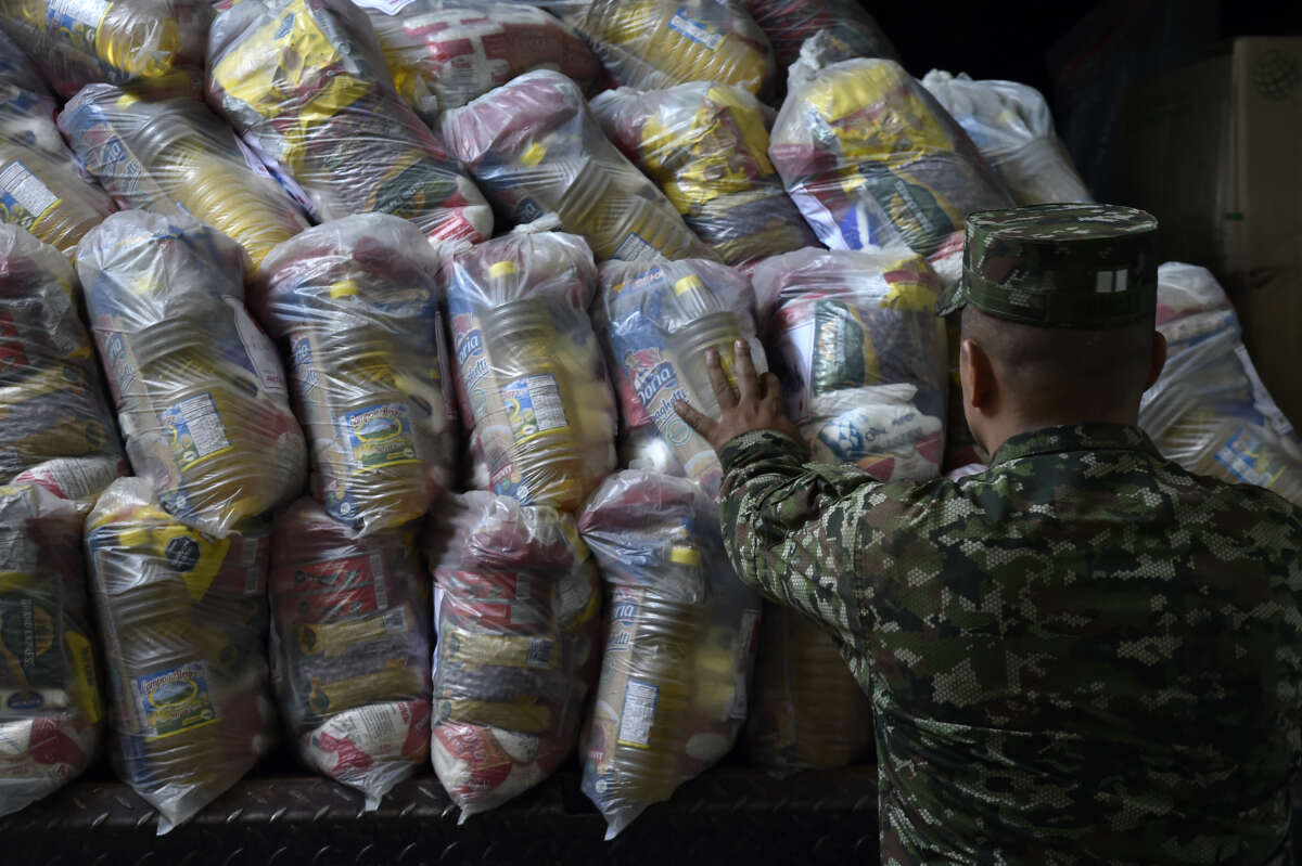 Members of the National Army's Integral Action and Development Support Command arrange 38 tonnes of humanitarian aid for the population of Catatumbo at the Food Bank Foundation of the Diocese of Cucuta, in Cucuta, Norte de Santander, Colombia, on January 26, 2025.