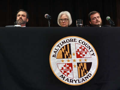 Baltimore County Executive Katherine Klausmeier (center) attends a District 1 Budget Town Hall meeting with Budget Director Kevin Reed (left) and Councilman Pat Young (right) at CCBC Catonsville, in Catonsville, Maryland.