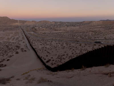 A portion of the U.S. border wall overlooking New Mexico, Texas, and Cuidad Juarez, Mexico is seen from a hill in Sunland Park, New Mexico, after sunset on February 25, 2025.