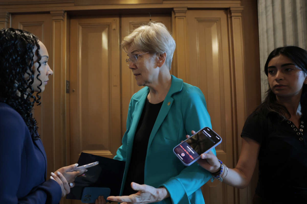 U.S. Sen. Elizabeth Warren speaks to reporters outside of the Senate Chambers during a vote at the U.S. Capitol on July 10, 2025, in Washington, D.C.