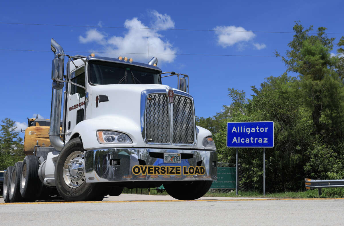 Vehicles exit from "Alligator Alcatraz" at the Dade-Collier Training and Transition Airport on August 14, 2025, in Ochopee, Florida.