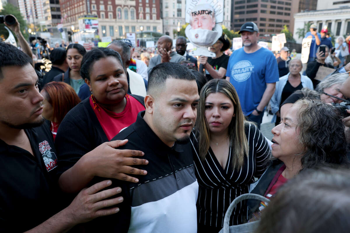 Kilmar Abrego Garcia and his wife Jennifer Vasquez Sura enter a U.S. Immigration and Customs Enforcement (ICE) field office on August 25, 2025 in Baltimore, Maryland.