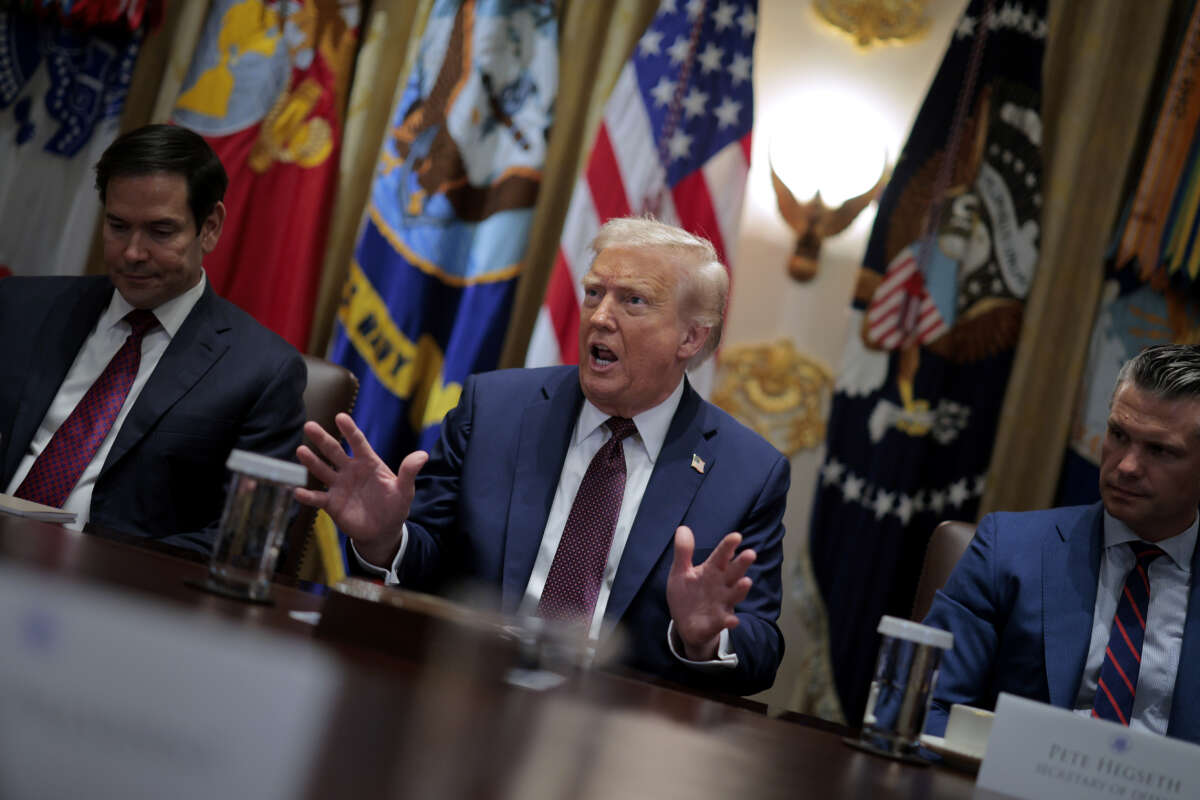 Secretary of State Marco Rubio (L) and Defense Secretary Pete Hegseth listen to U.S. President Donald Trump speak a cabinet meeting with members of his administration in the Cabinet Room of the White House on August 26, 2025, in Washington, D.C.