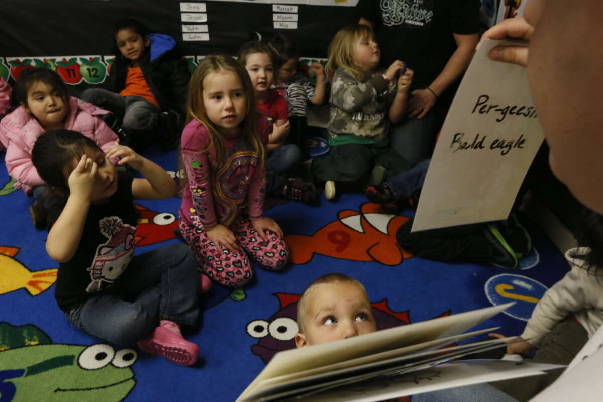 Mike Carlson, 19, teaches pre-school age children Yurok words at the Klamath Family Head Start program.