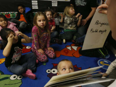 Mike Carlson, 19, teaches pre-school age children Yurok words at the Klamath Family Head Start program.
