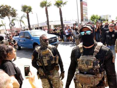 Residents confront federal agents and Border Patrol agents.