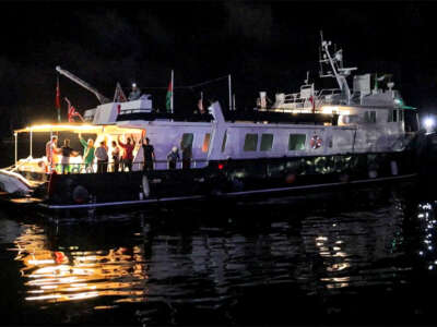 This grab from AFPTV footage shows activists riding aboard the British-flagged yacht Alma, which is part of the international flotilla for Gaza.