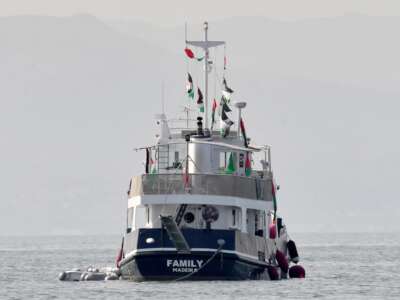 A ship, known as the "Family," part of the Global Sumud Flotilla, is anchored off the coast of the village of Sidi Bou Said on September 9, 2025.
