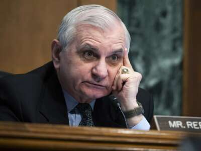 Sen. Jack Reed (D-Rhode Island) listens as U.S. Federal Reserve Chair Jerome Powell testifies at a Senate Banking, Housing, and Urban Affairs Committee hearing on Capitol Hill on March 3, 2022 in Washington, D.C.