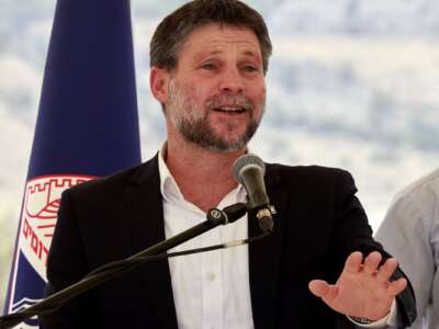 Israeli Finance Minister Bezalel Smotrich speaks during a press conference near the settlement of Maale Adumim in the occupied West Bank, on August 14, 2025.