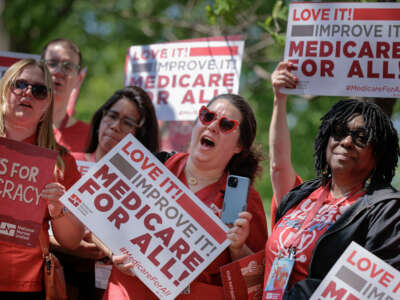 Members of National Nurses United rally with lawmakers to show their support for the Medicare For All Act in Upper Senate Park on Capitol Hill on April 29, 2025, in Washington, D.C.