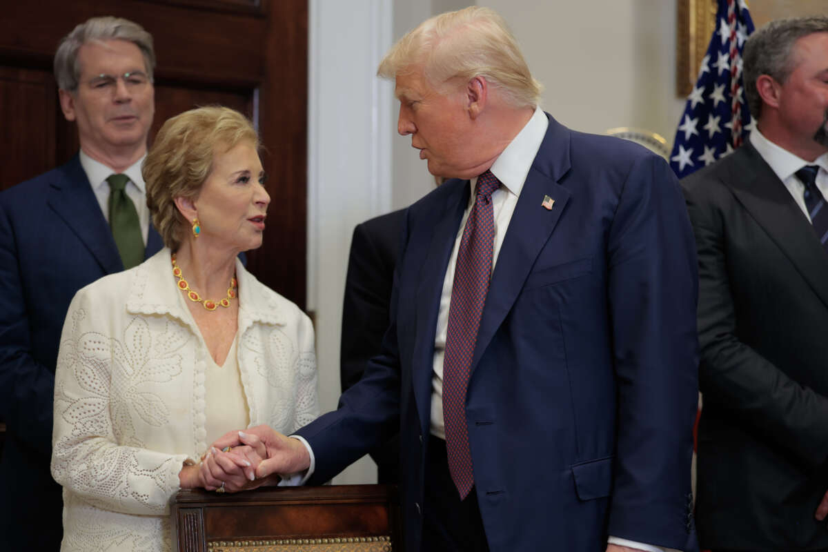 U.S. President Donald Trump speaks with Secretary of Education Linda McMahon during an executive order signing ceremony in the Roosevelt Room of the White House on July 31, 2025, in Washington, D.C.