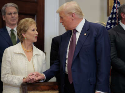 U.S. President Donald Trump speaks with Secretary of Education Linda McMahon during an executive order signing ceremony in the Roosevelt Room of the White House on July 31, 2025, in Washington, D.C.
