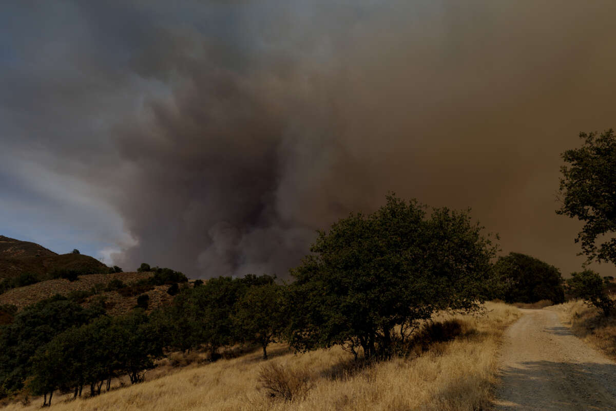 Smoke rises from a hillside as the Gifford Fire burns on August 6, 2025, in Los Padres National Forest, California.