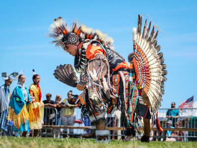 Jonathan Baca of Northern Colorado, center, dancing with other Native Americans during the 43rd Paumanauke Pow Wow at Tanner Park in Copiague, New York, on August 9, 2025.