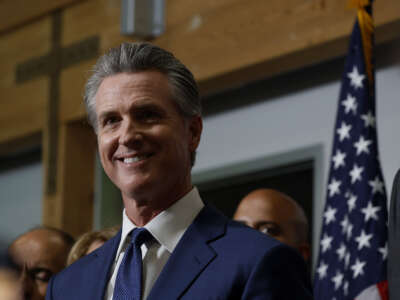 California Gov. Gavin Newsom looks on during a news conference to kick off the Yes on 50 campaign at the California Democratic Party Headquarters on August 21, 2025, in Sacramento, California.