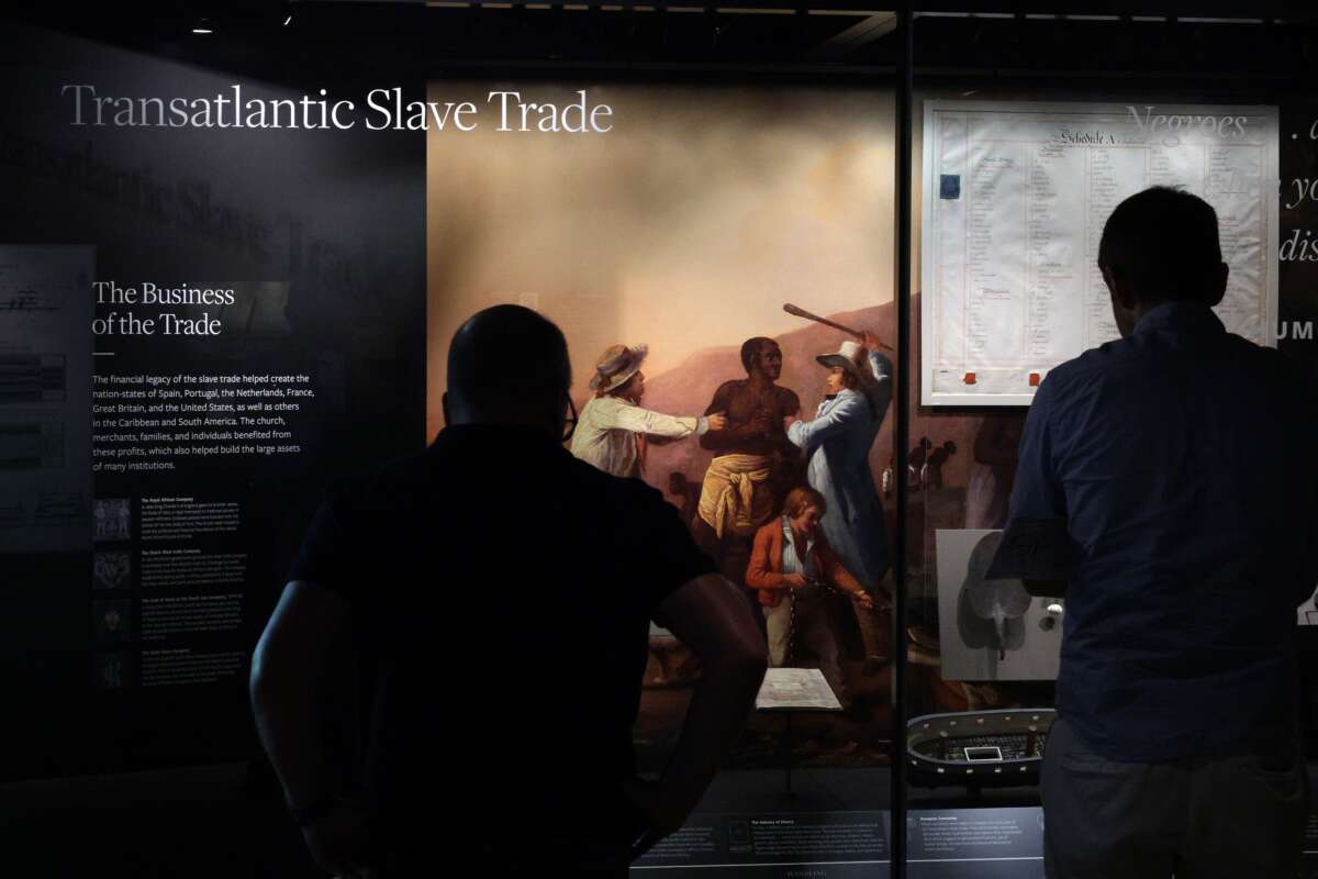 Visitors browse an exhibition about slavery in the United States at the National Museum of African American History and Culture on August 28, 2025, in Washington, D.C.