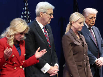 President Donald Trump bows his head in prayer with Pastor Paula White, Texas Lt. Gov. Dan Patrick, and Attorney General Pam Bondi at the Museum of the Bible on September 8, 2025, in Washington, D.C.