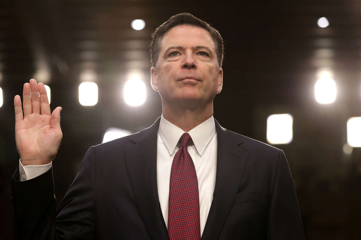 Former FBI Director James Comey is sworn in while testifying before the Senate Intelligence Committee in the Hart Senate Office Building on Capitol Hill on June 8, 2017, in Washington, D.C. Comey said that President Donald Trump pressured him to drop the FBI's investigation into former National Security Advisor Michael Flynn and demanded Comey's loyalty during the one-on-one meetings he had with the president.